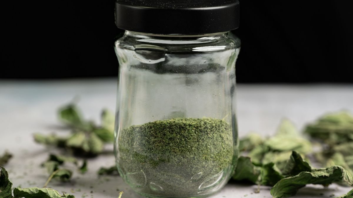 Dried herbs stored in labeled glass jars