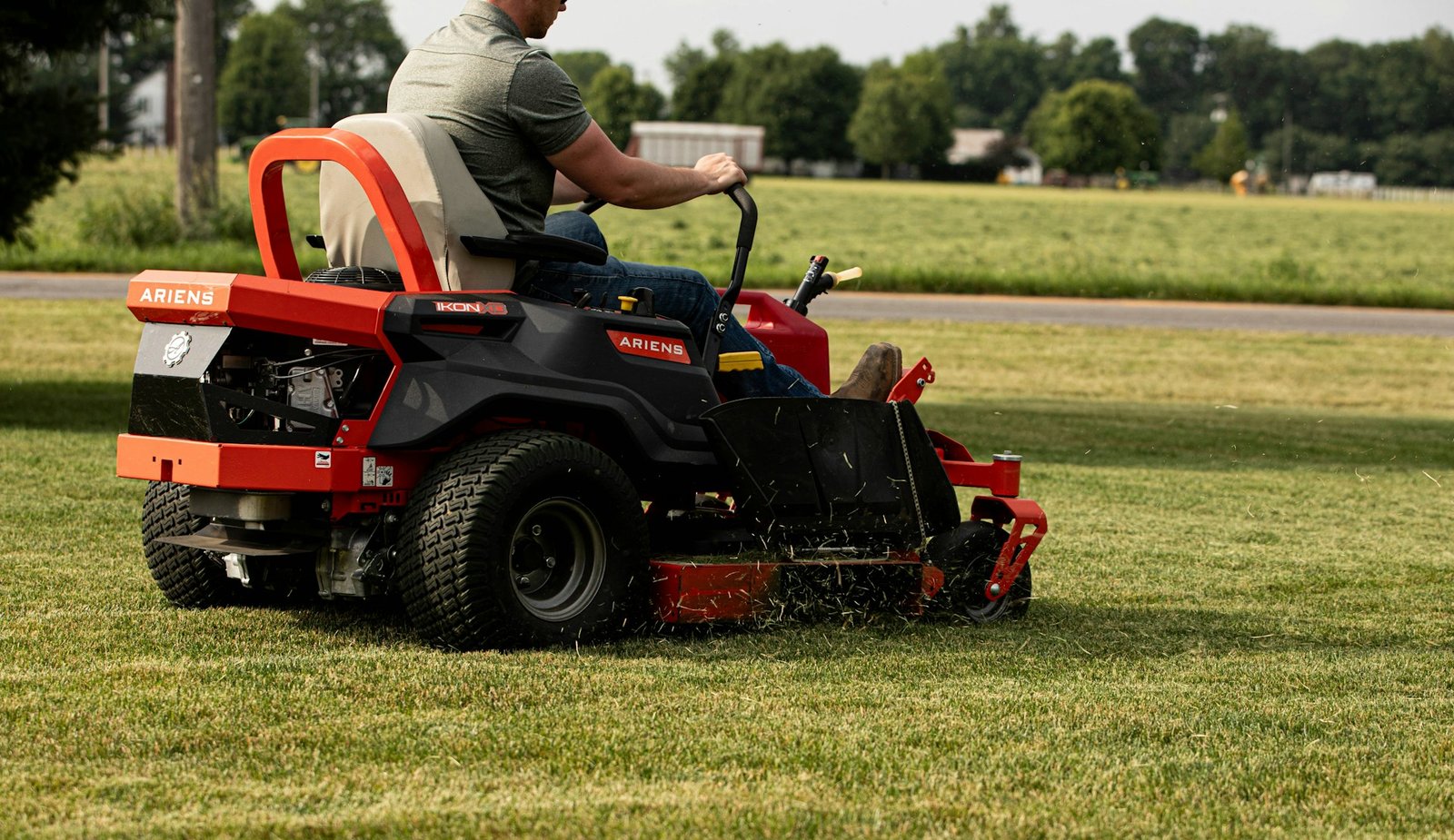 Mowing a newly seeded lawn with the mower set high