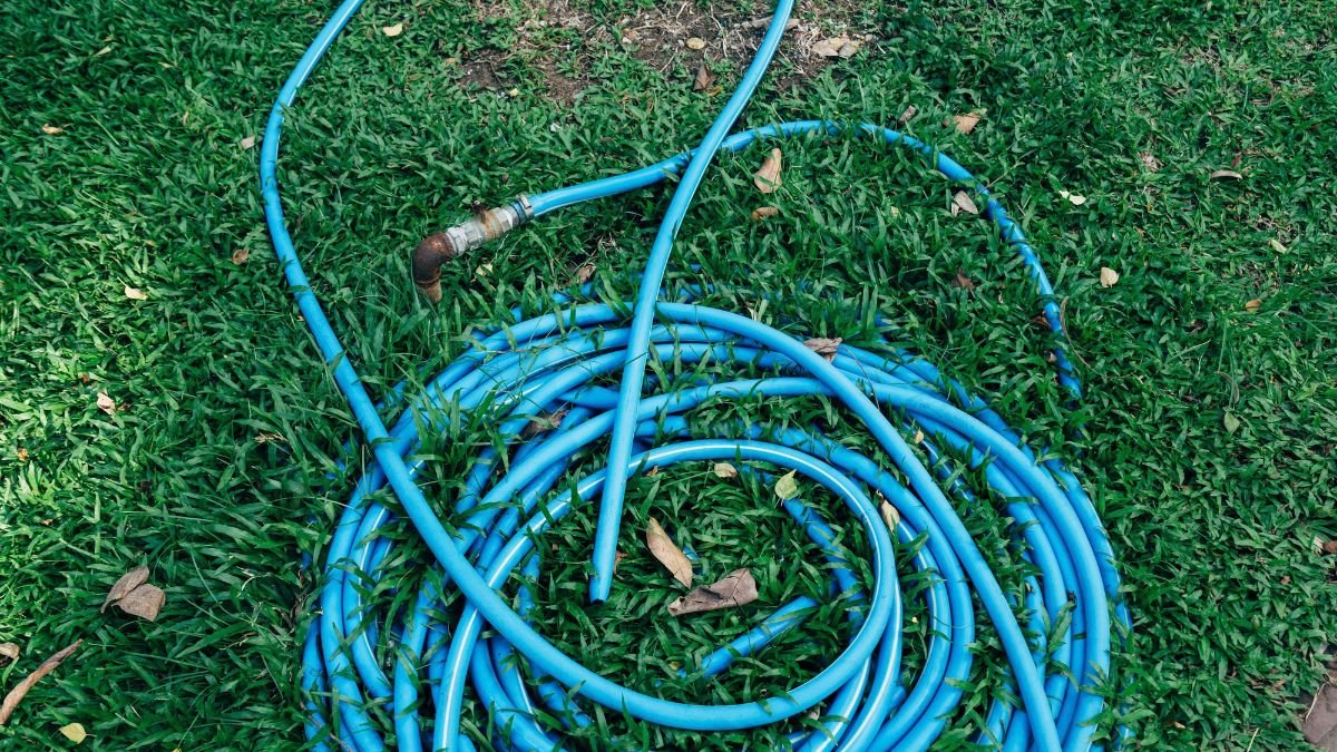 Coiled garden hose ready for winter storage