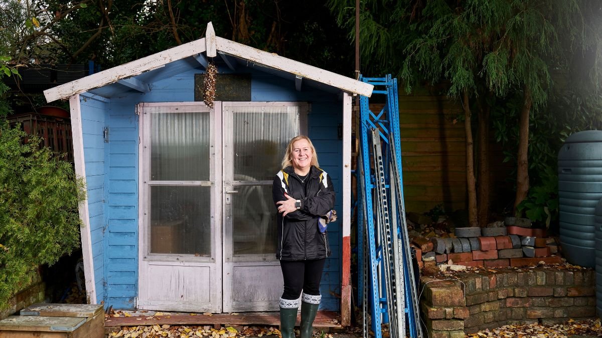 Clean garden tools hanging in a shed for winter storage